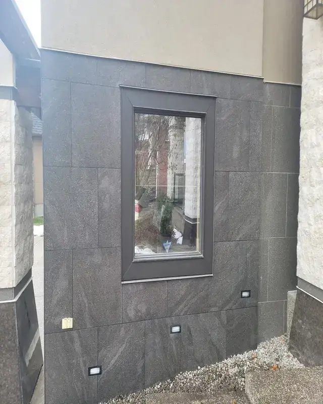 Finished marble tile installation around a garage - detail view