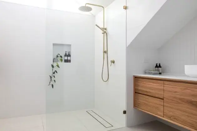 porcelain tiles installed on a bathroom white colour with brown countertop