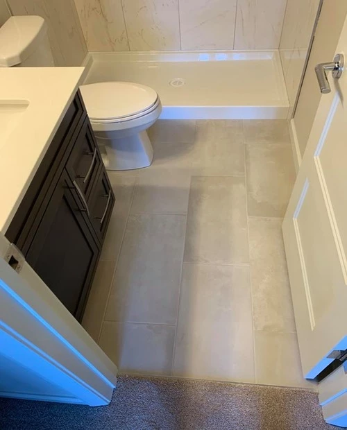 Newly installed bathroom tiles on the floor