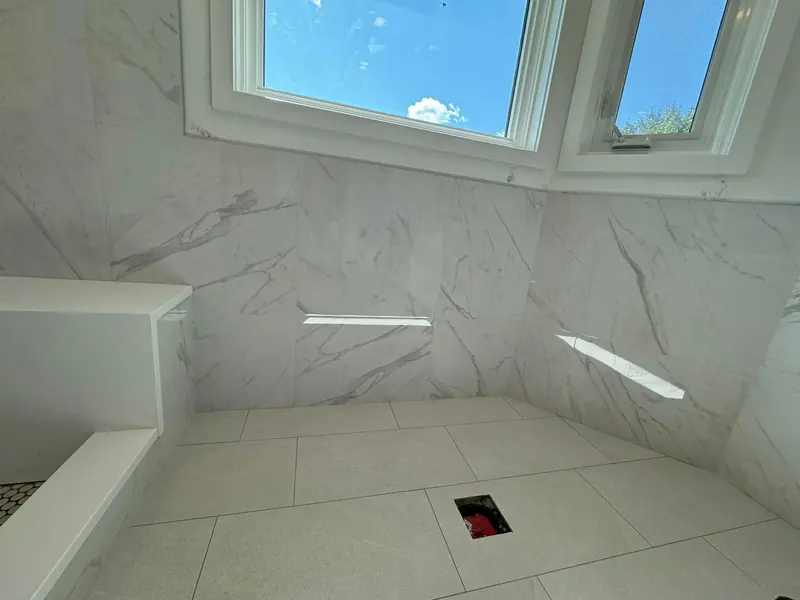 Bathroom wall tiling in progress on a Calgary remodel