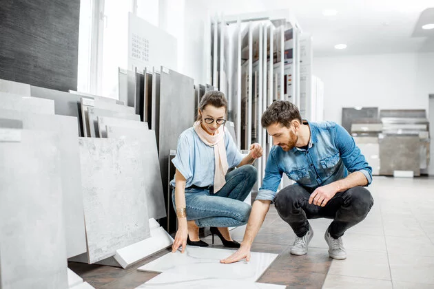 couple choosing tiles in a tile store