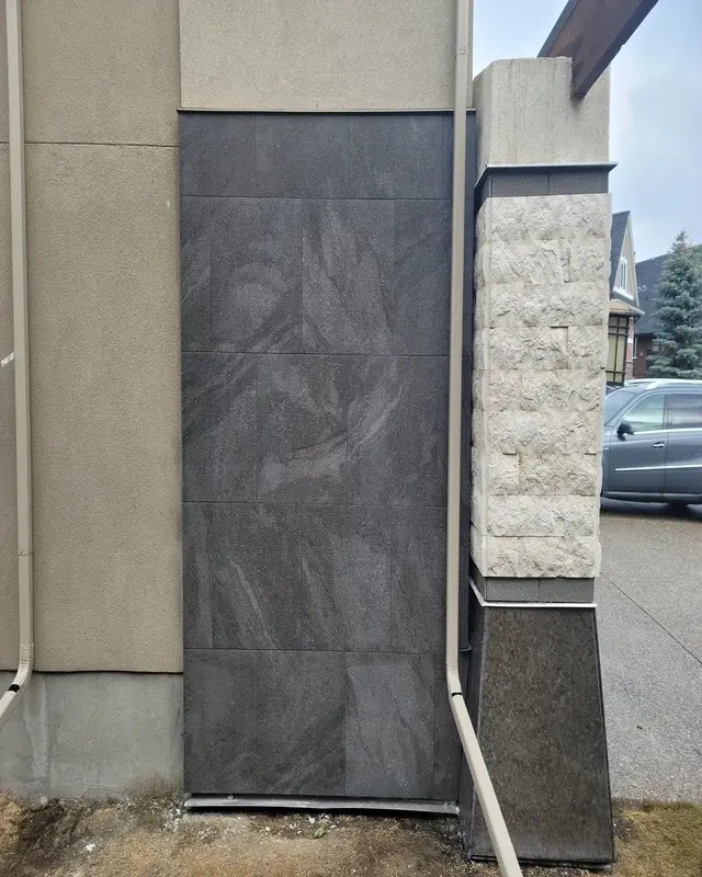 Finished marble tile installation around a garage - wide view