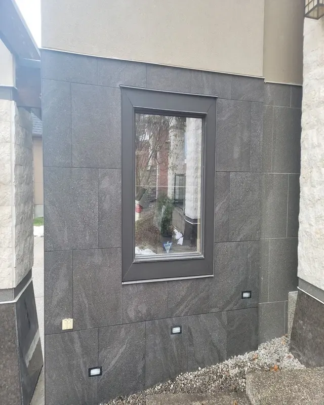 Finished marble tile installation around a garage - detail view