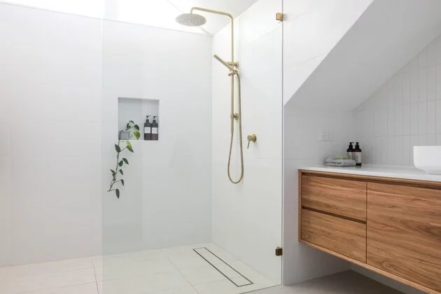 porcelain tiles installed on a bathroom white colour with brown countertop