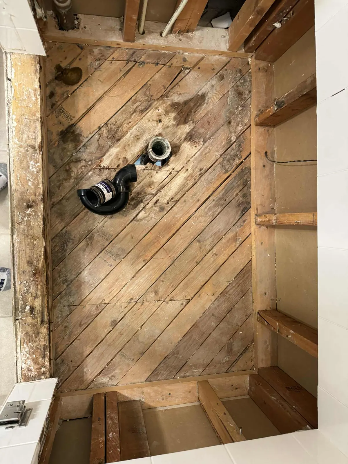 Water damage exposed to a shower base rough framing - prepped for rebuild