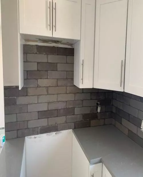 brick looking tiles installed in a kitchen