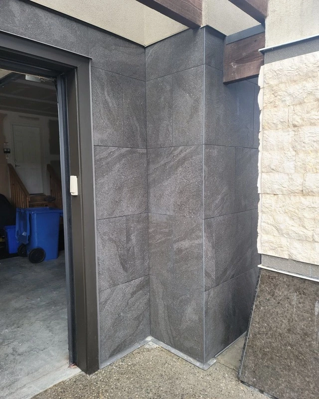 installed marble tiles right side of a garage in bearspaw