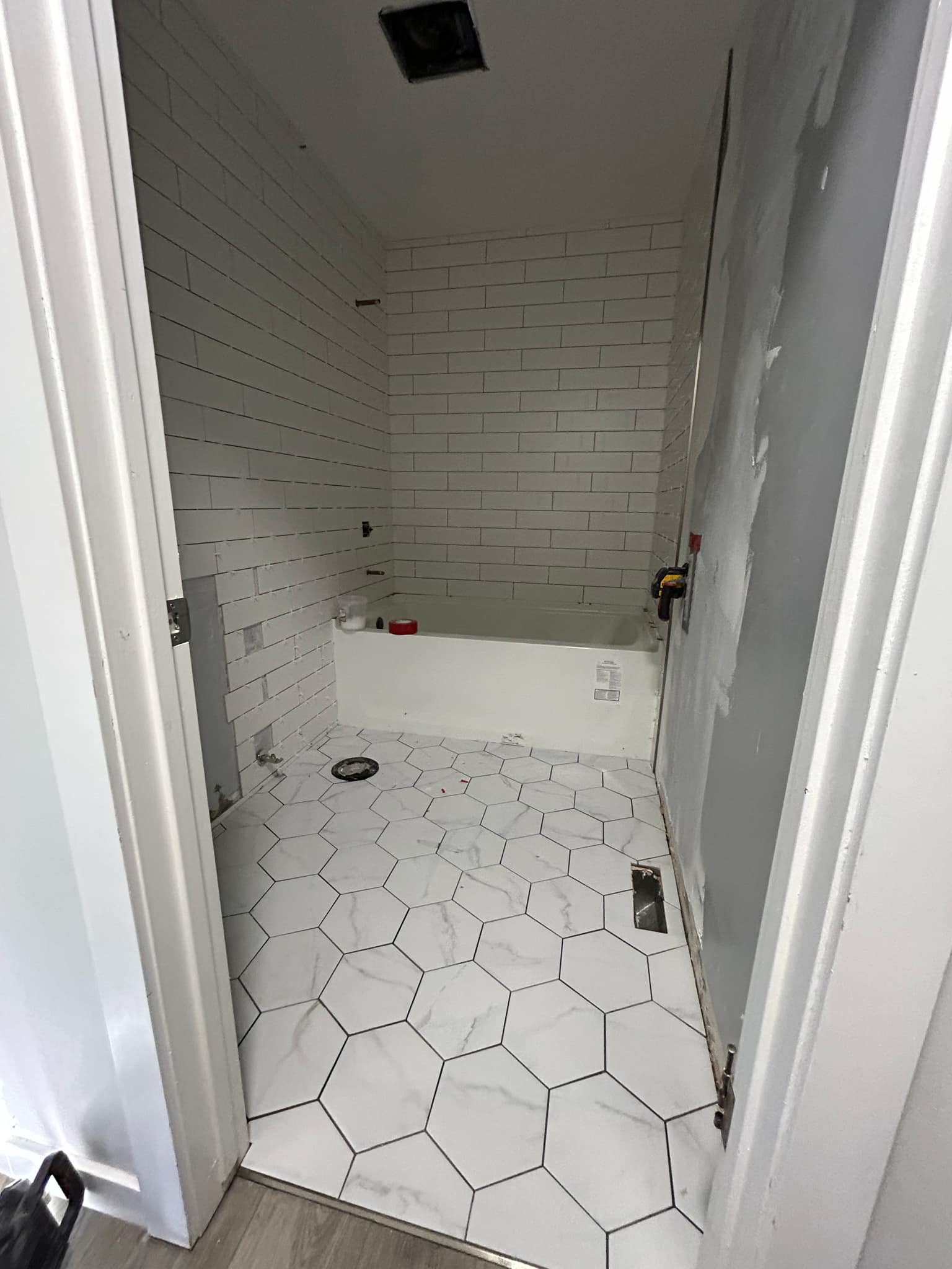 bathroom upgrade with intricate tile design and minimalist fixtures