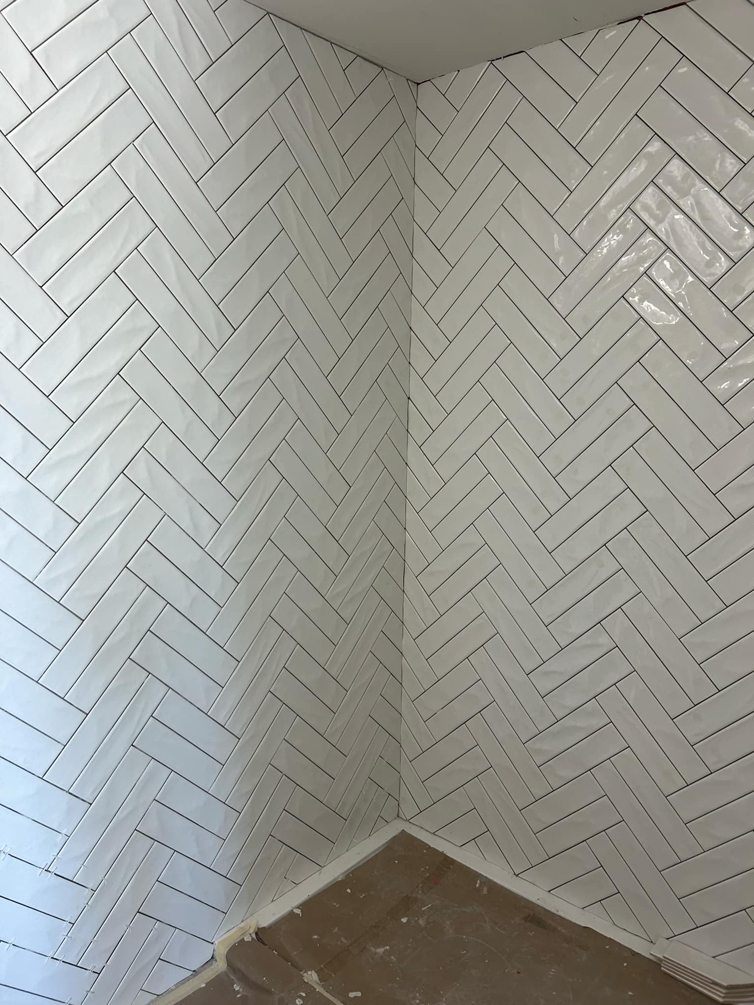 Stylish bathroom transformation featuring custom tile patterns