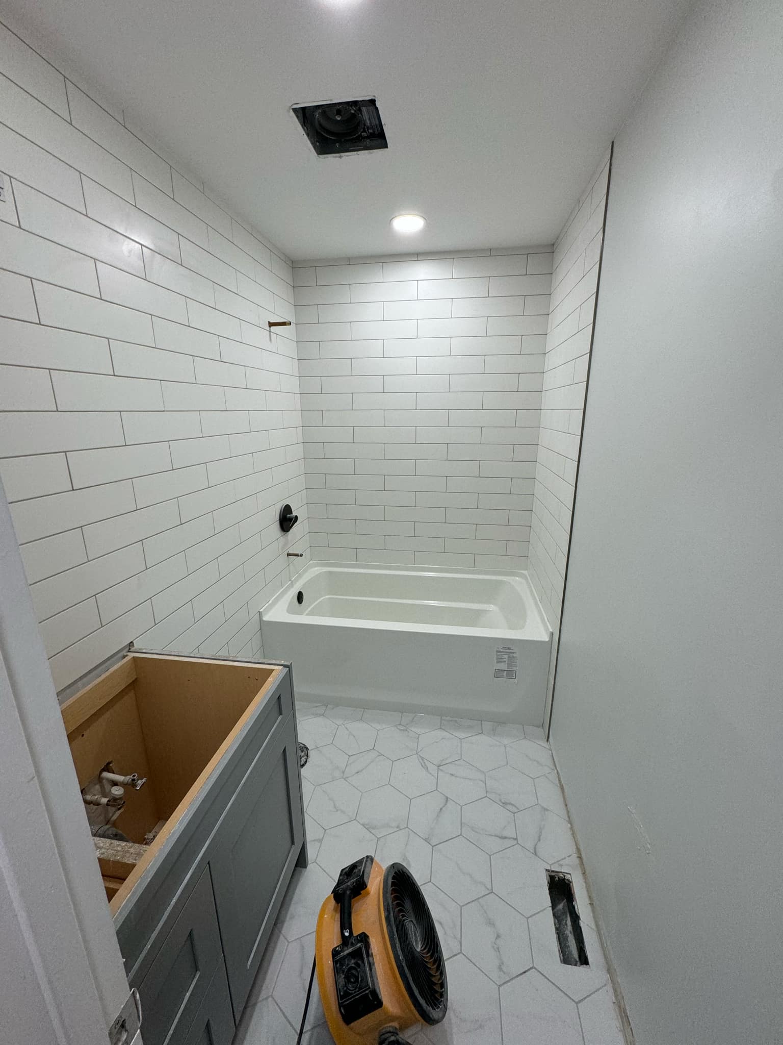 Professional bathroom renovation showcasing unique tile work